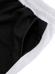 Black sweatpants with white contrast stripe detail and drawstring waist.