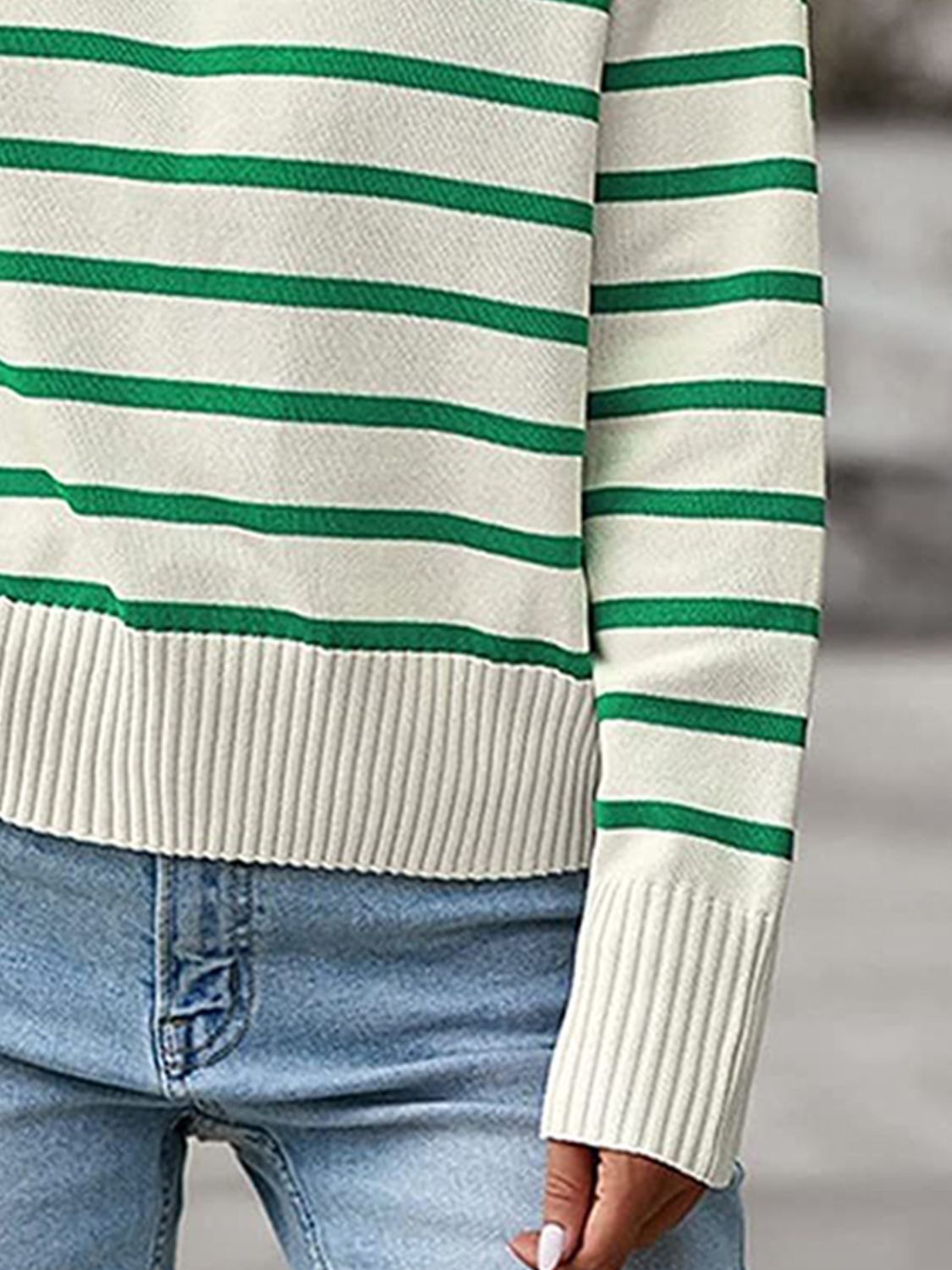 Striped knit polo sweater in cream with green stripes, ribbed cuffs and hem.