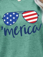 Green graphic t-shirt with aviator sunglasses and 'merica script