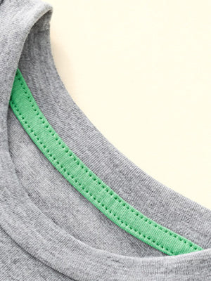 Grey toddler t-shirt with green contrast stitching detail on the neckline.