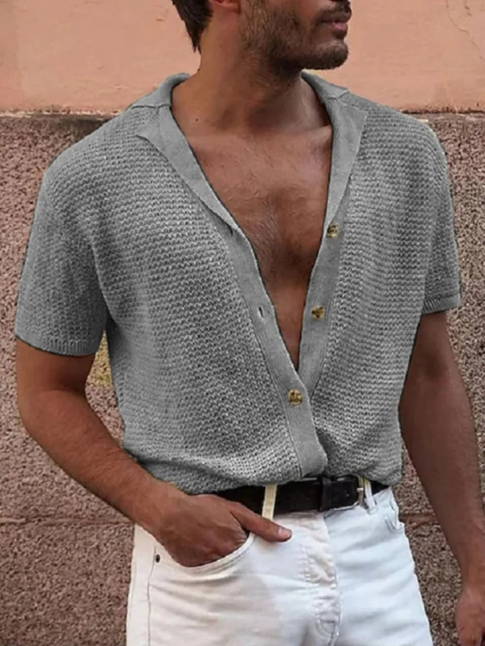 Gray textured knit resort shirt with short sleeves and button front.
