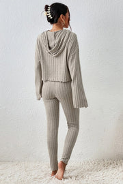 Beige ribbed knit cropped hoodie and leggings lounge set with raw hem details.