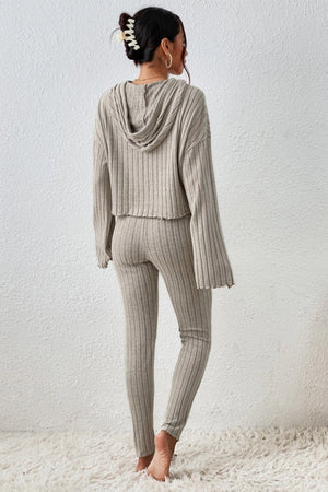 Beige ribbed knit cropped hoodie and leggings lounge set with raw hem details.