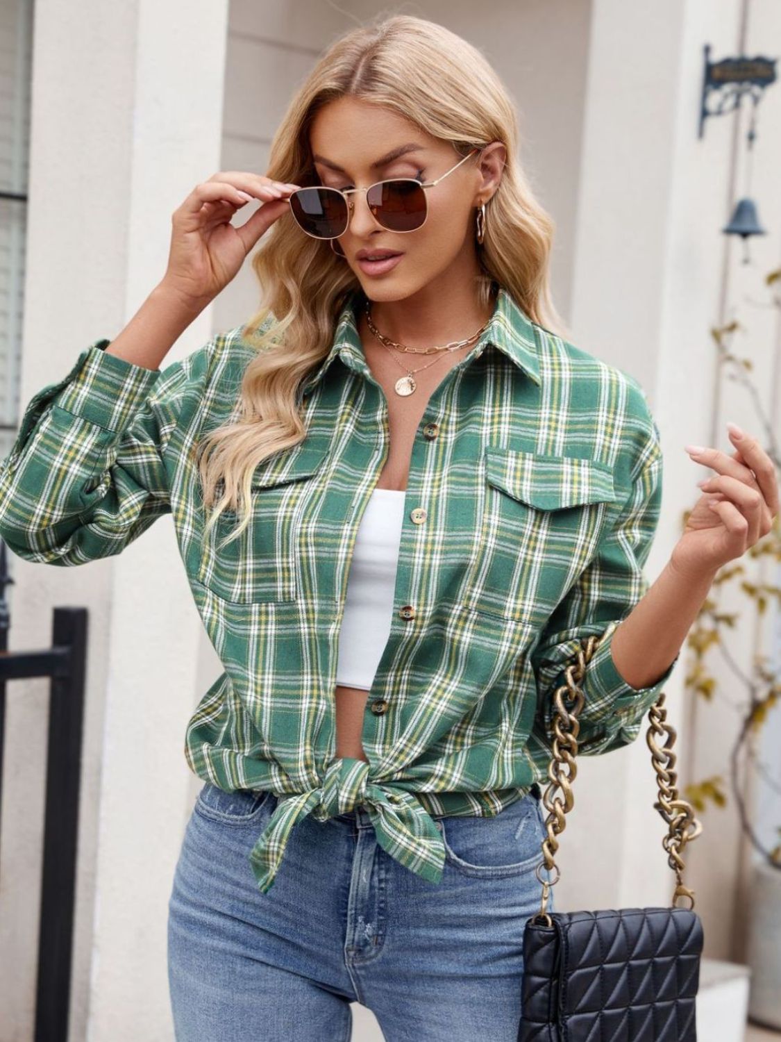 Green plaid overshirt with patch pockets and buttoned front, tied at the waist.