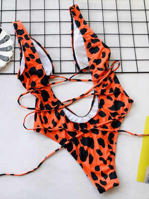 Tangerine snakeskin plunge swimsuit with lace-up back detail