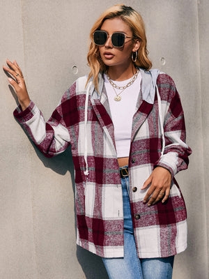 Oversized burgundy plaid shacket with hood and white drawstring.