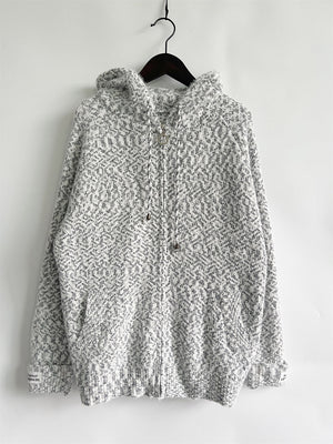 Speckled knit relaxed zip-up hoodie in white with a geometric pattern and drawstring hood.