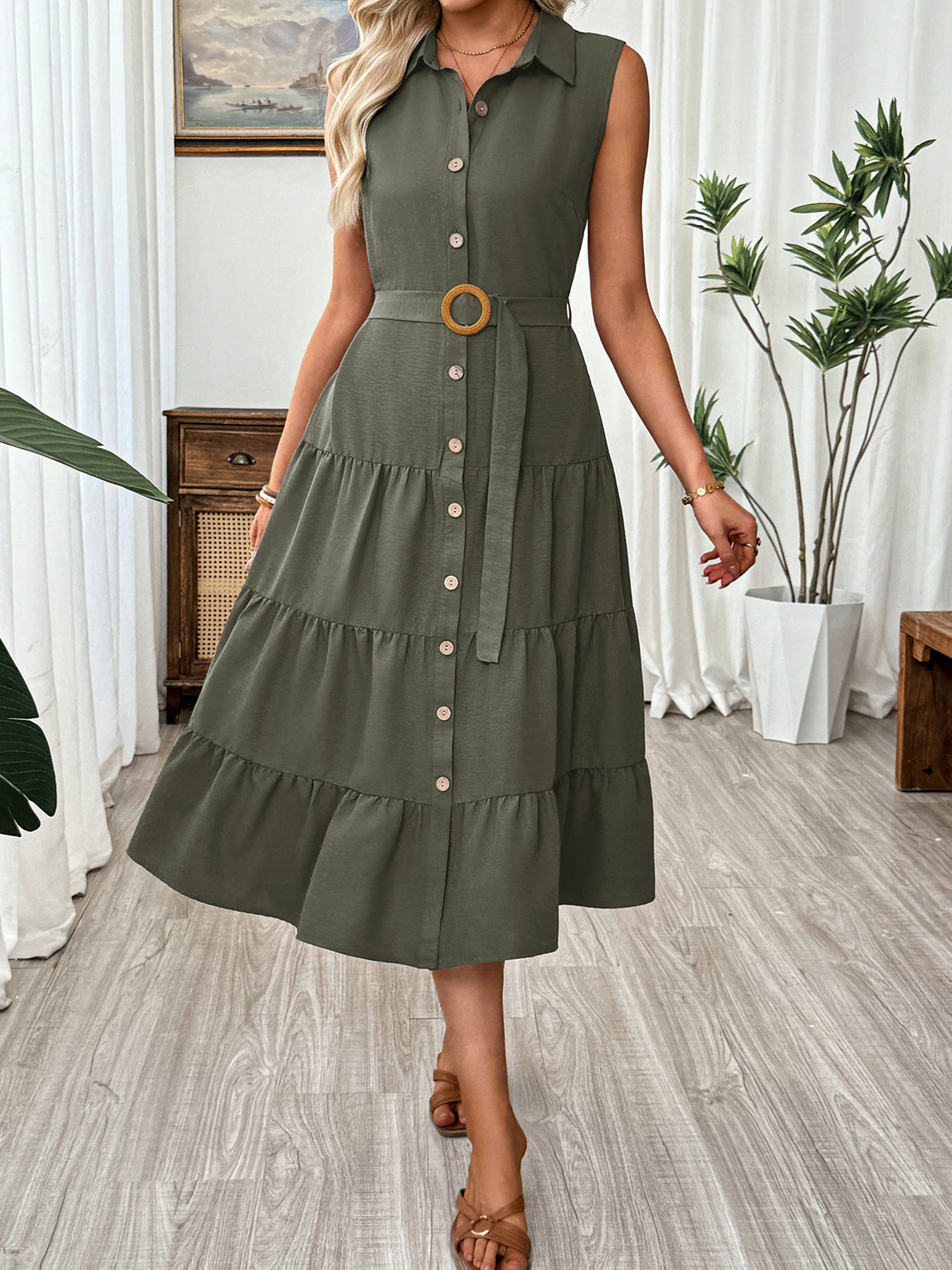 Button-down midi dress in olive green with tiered skirt and belted waist.