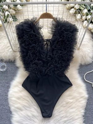 Black ruffled V-neck bodysuit with lace detail and tie closure.