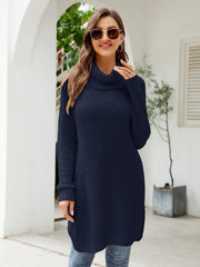 Dark blue waffle knit tunic with cowl neckline and long sleeves, styled casually.