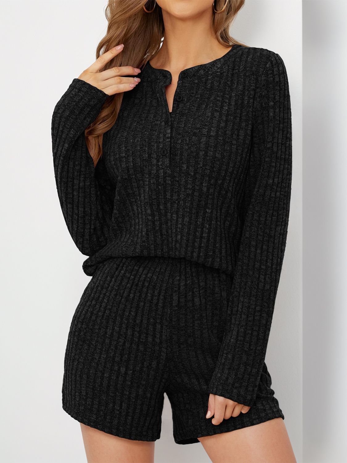 Black ribbed henley loungewear set with button detail and shorts.