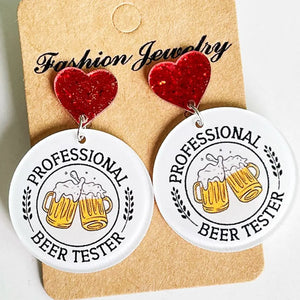 Festive acrylic novelty drop earrings with red glitter hearts and beer mug graphics.