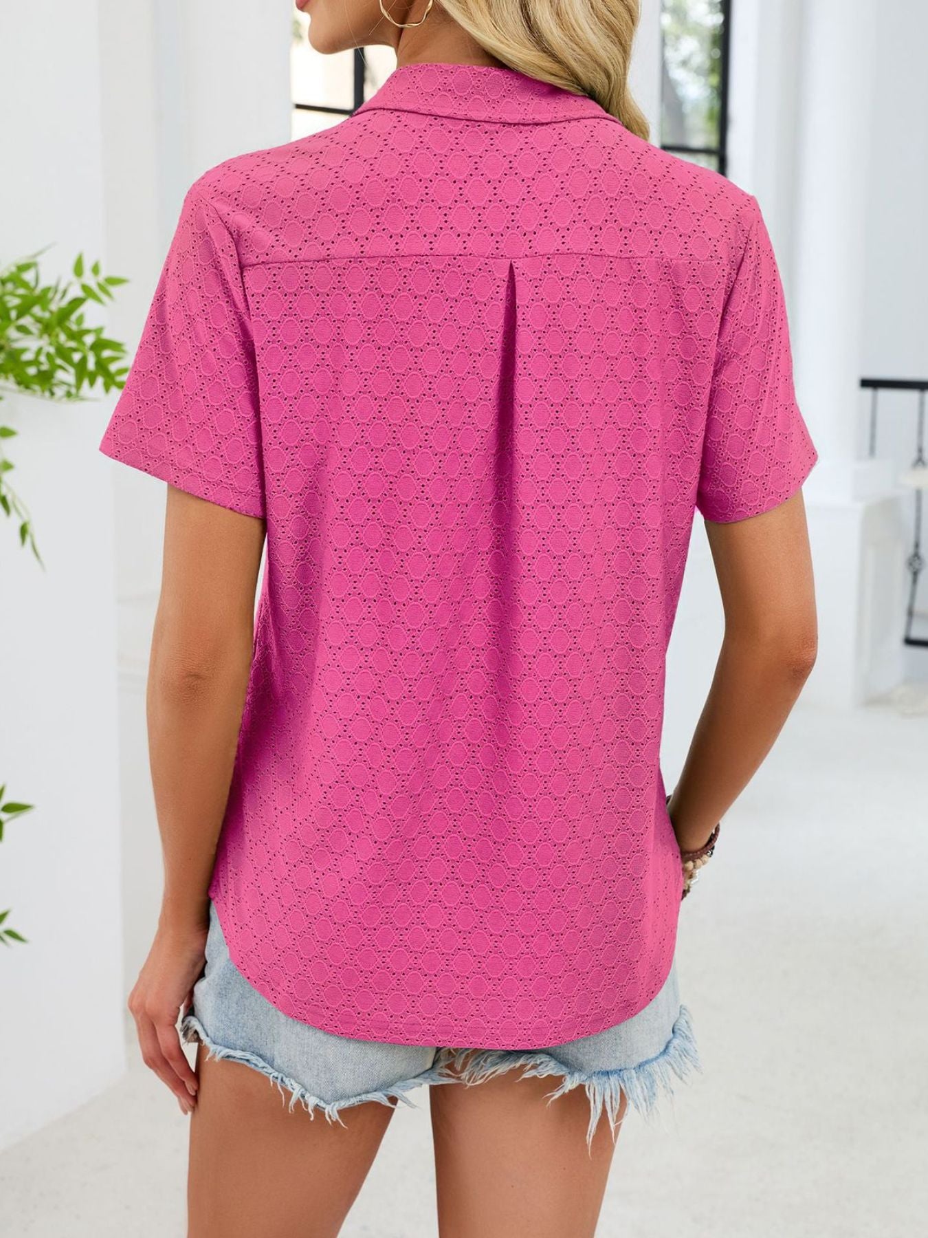 Hot Pink eyelet polo collar blouse with short sleeves and a relaxed fit.