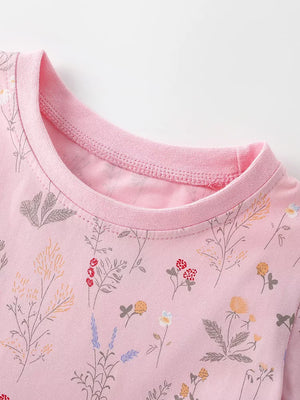 Children's pink floral print A-line dress with crew neck and pink trim.