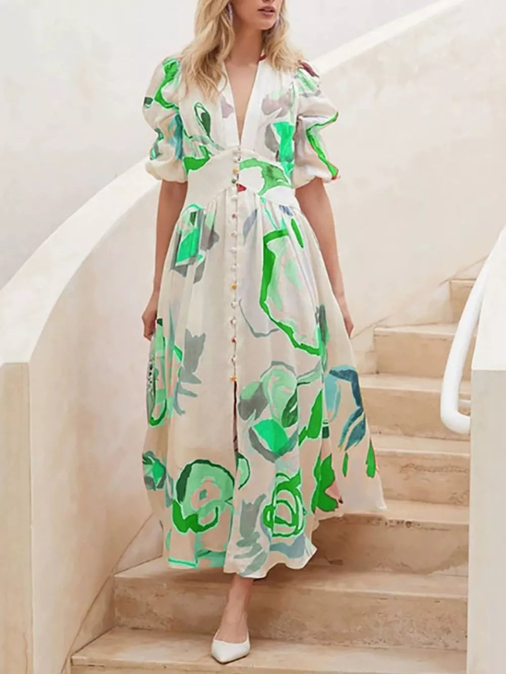 Midi dress with abstract print, puff sleeves, and button front in white with green accents.