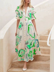 Midi dress with abstract print, puff sleeves, and button front in white with green accents.