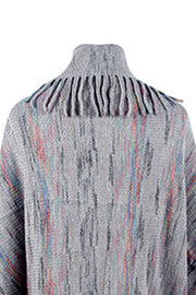 Textured knit cape in charcoal with colorful threads and fringe trim detail