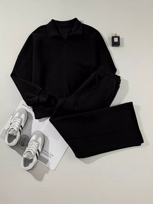 Black zip-up jacket and drawstring pants set, cotton, casual activewear.