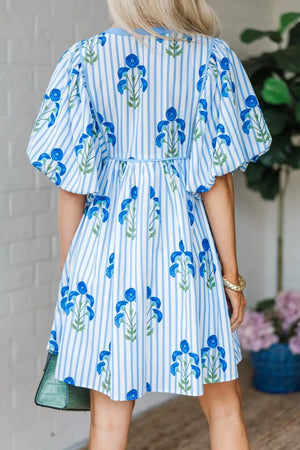 Floral stripe puff sleeve mini dress with blue floral print and adjustable waist.