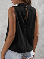 Black eyelet tank top with ruffled neckline and back tie detail