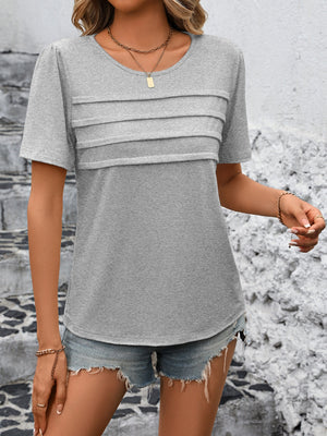 Light gray jersey top with pleated bodice detail and short sleeves.