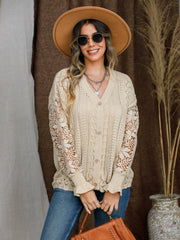 Tan knit cardigan with lace sleeves and button front.