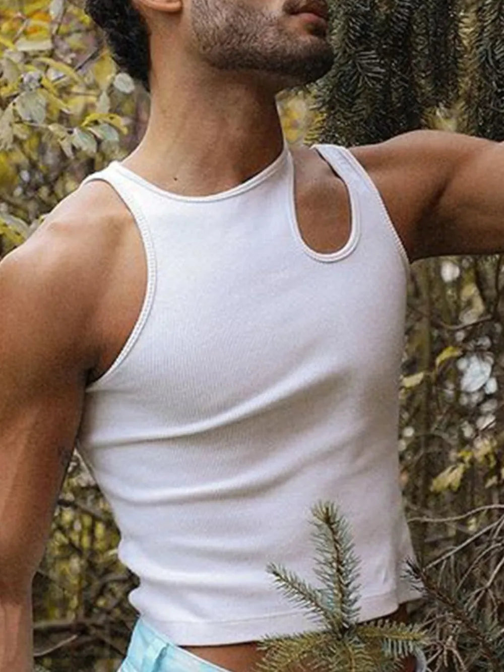 White ribbed tank top with asymmetrical neckline and sculpted shoulder detail.