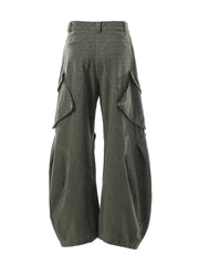 Textured paneled cargo pants in army green with baggy fit and multiple flap pockets.