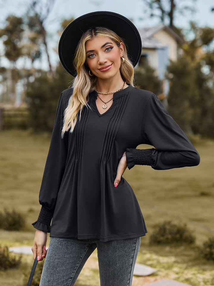 Black long sleeve blouse with pleated yoke and shirred cuffs