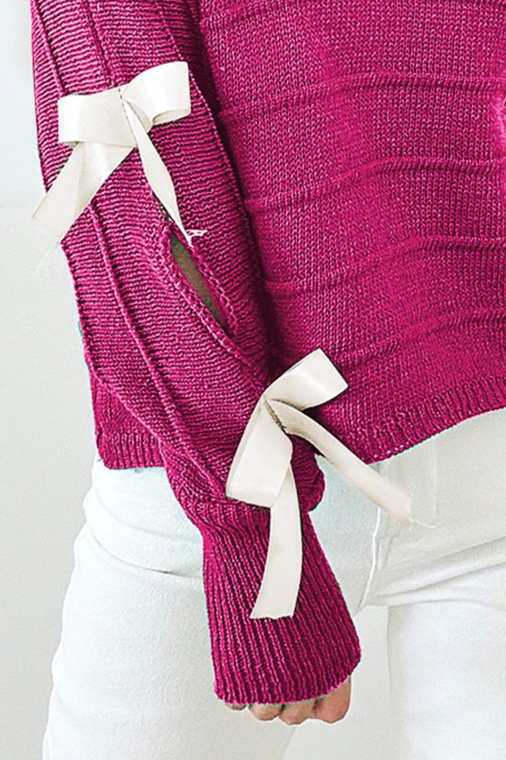 Deep Rose ribbed knit sweater with bow sleeve detail, acrylic fabric.