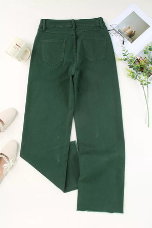 Green cotton straight-leg jeans with crossed v-waist detail and raw hem.