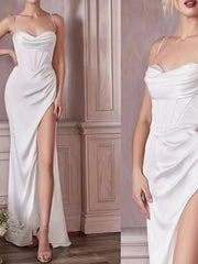 White satin maxi dress with cowl neck, corset bodice, and high slit.
