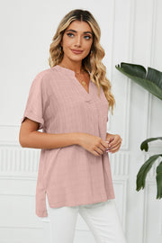 Dusty Pink linen blouse with V-neck, short sleeves, and subtle texture.