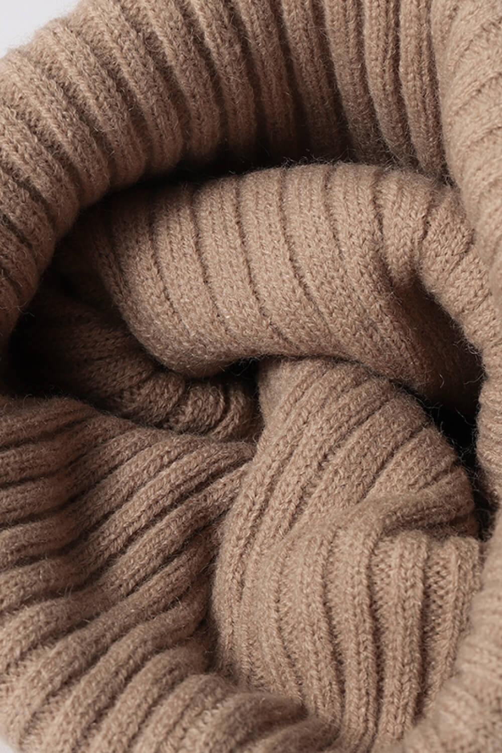 Beige acrylic ribbed beanie with a soft texture.