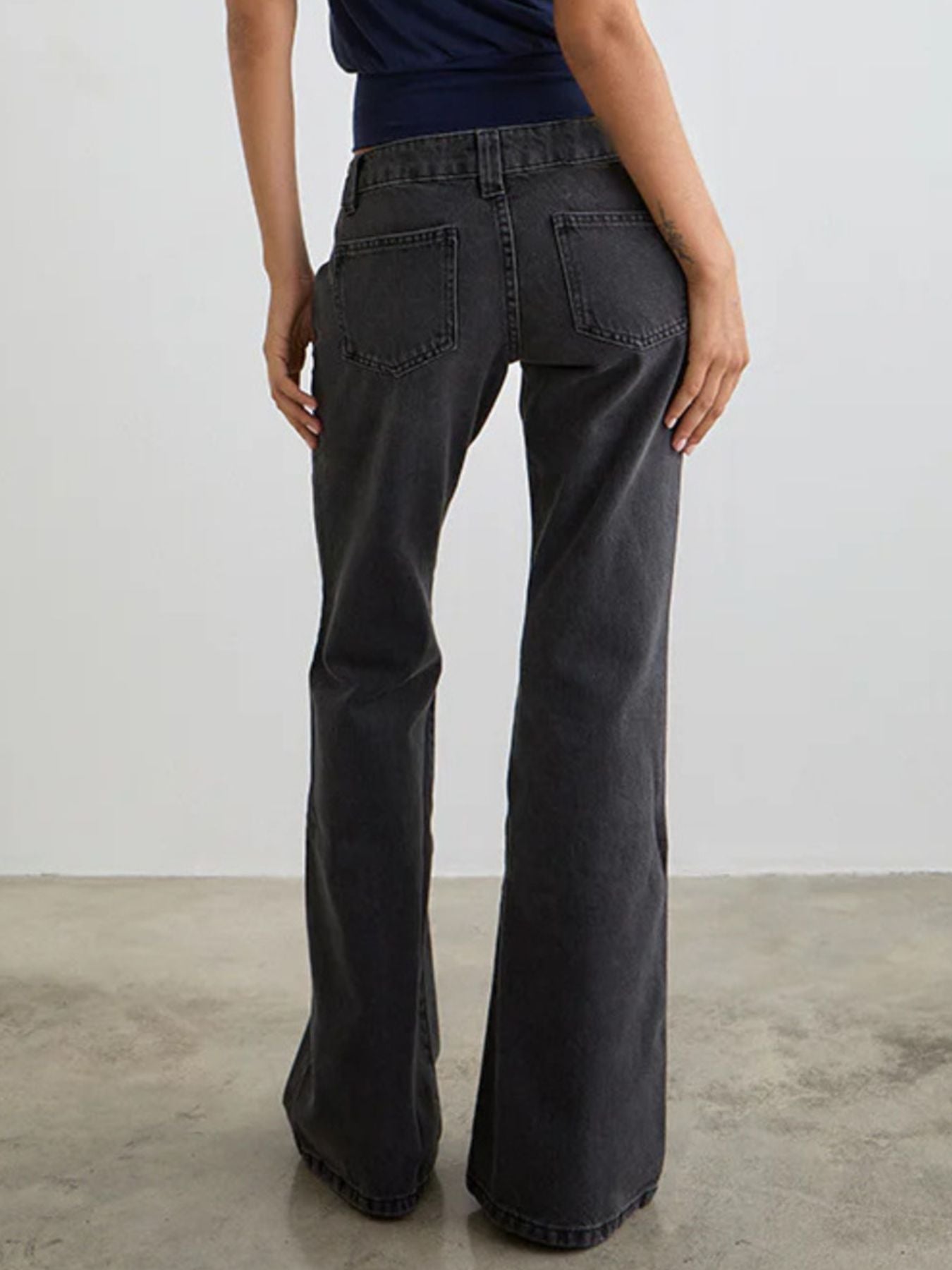 Dark gray low rise flare leg jeans with pockets and classic fit