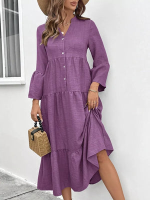 Purple tiered ruffle hem v-neck dress with button front and bell sleeves.