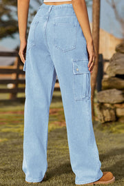 Light wash denim cargo pants with button flap pockets and wide leg.