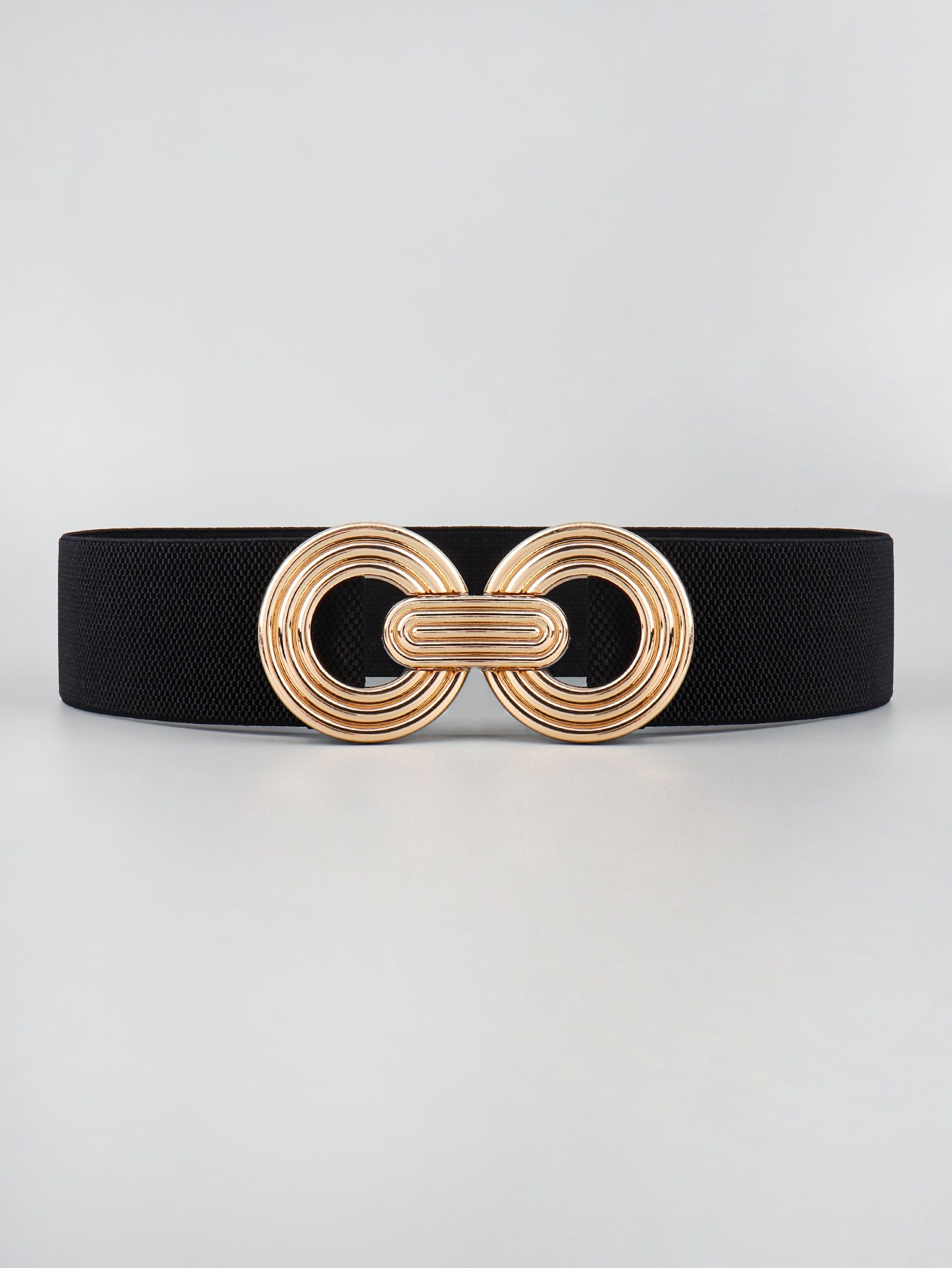 Black stretch belt with interlocking gold circle buckle
