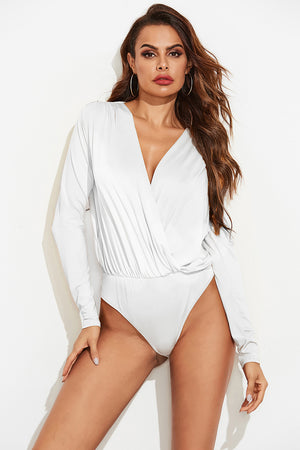 White long sleeve bodysuit with plunging neckline and draped front detail