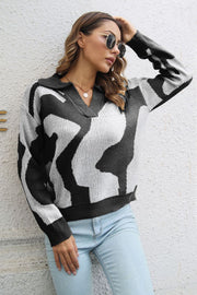 Women's black and white abstract print polo knit sweater, acrylic, collared V-neck, long sleeves.