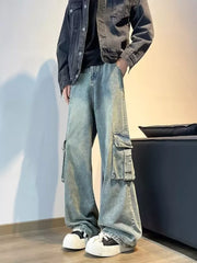 Vintage wash oversized wide-leg cargo jeans with distressed details and multiple pockets.