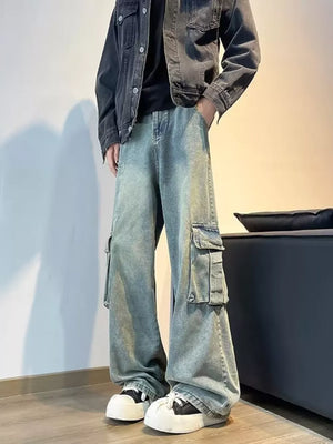Vintage wash oversized wide-leg cargo jeans with distressed details and multiple pockets.