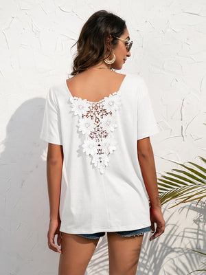 White t-shirt with floral lace detail on the back