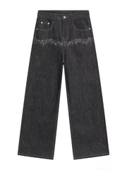 Loose fit dark wash cotton jeans with white embroidered musical notes across the front.