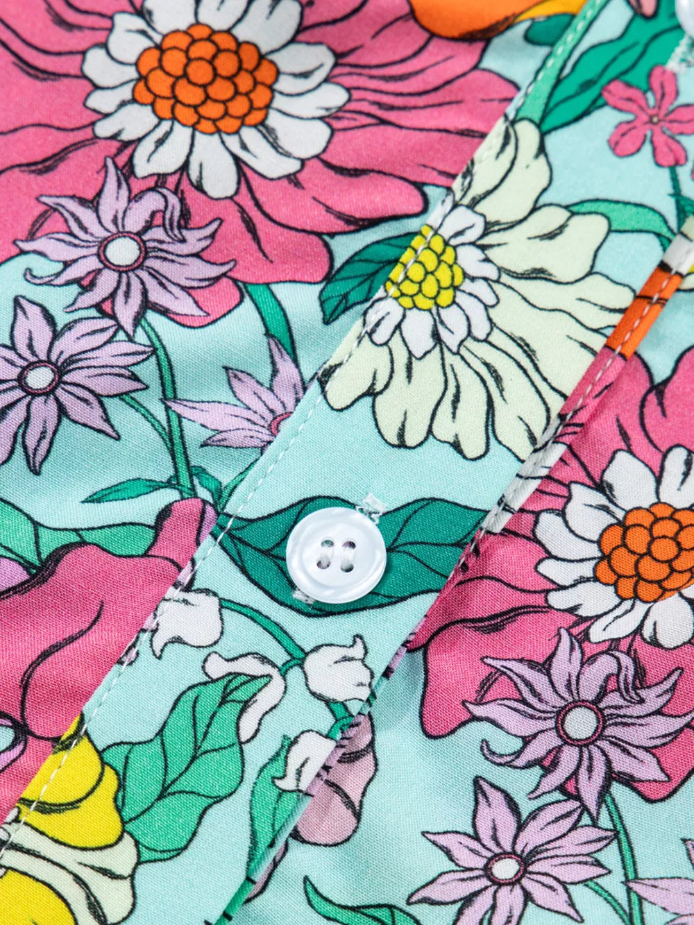 Maternity overshirt with vibrant floral print, button front, and flutter sleeves.