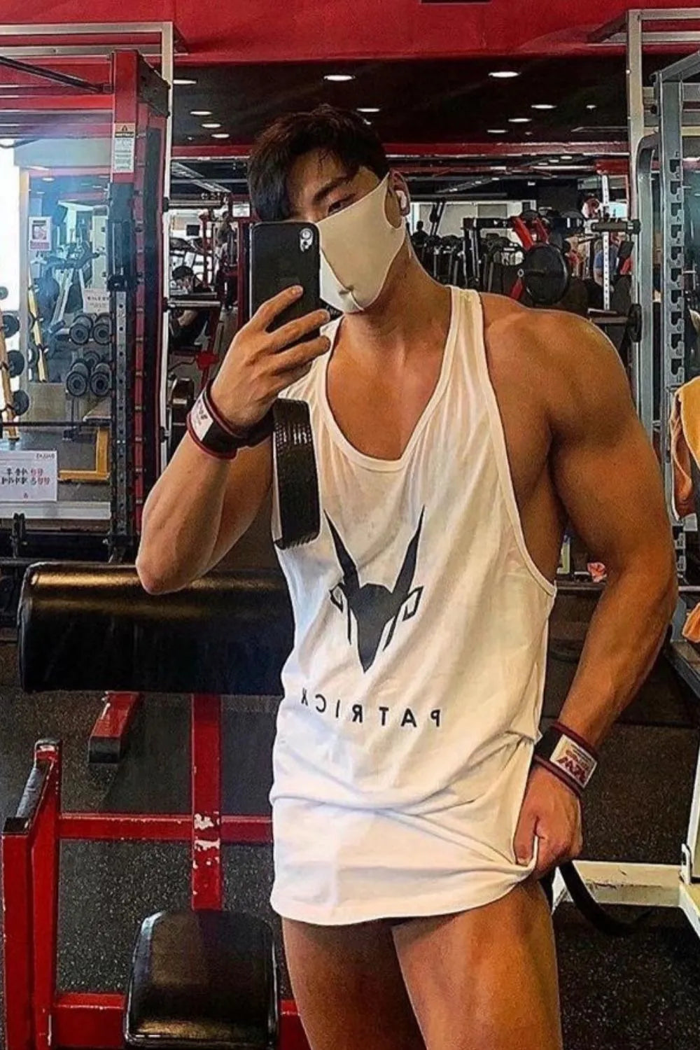 White graphic logo performance tank top with a scoop neck.