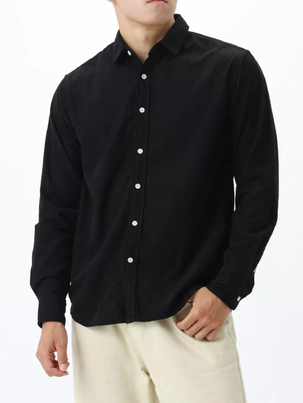 Black long sleeve buttoned shirt with a classic collar.