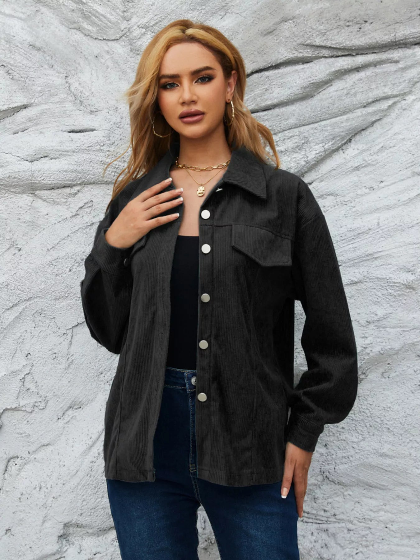 Black textured corduroy button-up jacket with chest pockets and silver buttons