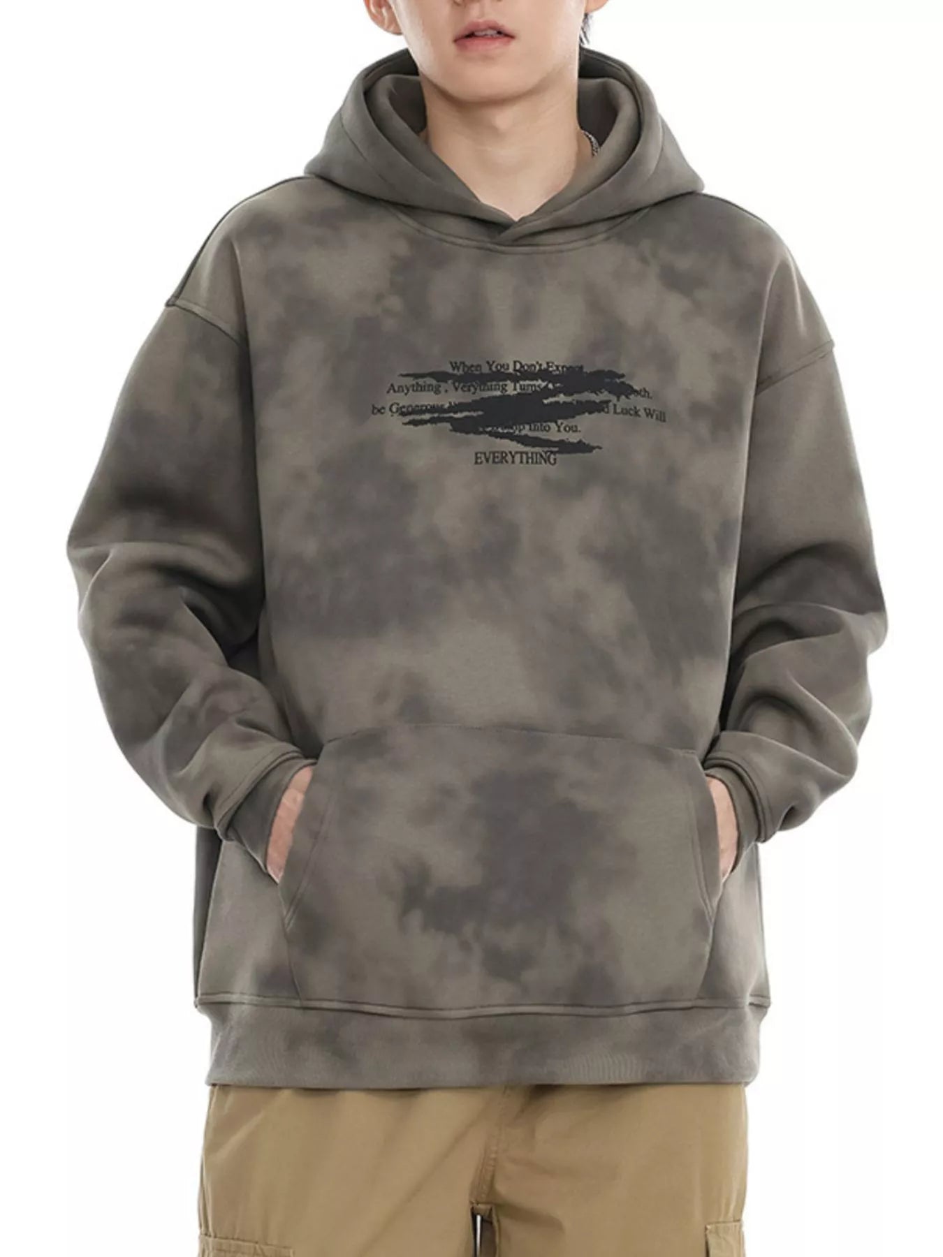 Oversized tie-dye hoodie in Cement Gray with graphic print and front pocket.