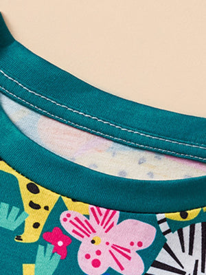 Toddler dress with teal neckline and playful jungle animal print.